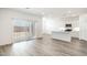 Modern kitchen with a large island and white cabinets at 15429 W Hackamore Dr, Surprise, AZ 85387