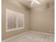 Bright bedroom with neutral walls and plantation shutters at 15639 E Palomino Blvd, Fountain Hills, AZ 85268