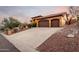 Home exterior showcasing a long driveway leading to a three-car garage at 15639 E Palomino Blvd, Fountain Hills, AZ 85268