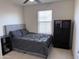 Bedroom featuring a modern bed and decorative storage at 16405 W Latham St, Goodyear, AZ 85338