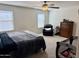 This bedroom features a chair, dresser, and a crib at 16405 W Latham St, Goodyear, AZ 85338