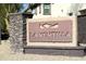 Community sign with a stacked stone base and a desert design at 16405 W Latham St, Goodyear, AZ 85338