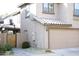 Two-story home exterior showcases a tile roof and attached two-car garage at 16405 W Latham St, Goodyear, AZ 85338