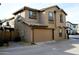 Two-story home with a two-car garage and desert landscaping at 16405 W Latham St, Goodyear, AZ 85338