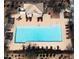 Aerial view of pool with lounge chairs and cabana at community center at 16405 W Latham St, Goodyear, AZ 85338