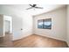 Bedroom with wood-look floors, ceiling fan and mountain views at 16439 E Nicklaus Dr, Fountain Hills, AZ 85268