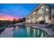 Luxury two-story home with pool and mountain views at sunset at 16439 E Nicklaus Dr, Fountain Hills, AZ 85268