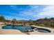 Stunning pool and spa with mountain views and a desert landscape at 16439 E Nicklaus Dr, Fountain Hills, AZ 85268