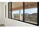 Bedroom with expansive mountain views from large windows at 16439 E Nicklaus Dr, Fountain Hills, AZ 85268