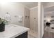 Bathroom with quartz vanity, modern fixtures and a large shower at 17052 N 36Th Ct, Phoenix, AZ 85032