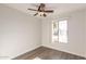 Well-lit bedroom with wood-look floors and a ceiling fan at 17052 N 36Th Ct, Phoenix, AZ 85032