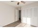 Bedroom with double door closet and wood-look floors at 17052 N 36Th Ct, Phoenix, AZ 85032