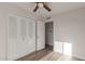 Bedroom with double door closet and wood-look floors at 17052 N 36Th Ct, Phoenix, AZ 85032