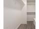 Spacious closet with built-in shelving and modern flooring at 17052 N 36Th Ct, Phoenix, AZ 85032