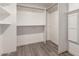 Large walk in closet with ample shelving and hanging space at 17052 N 36Th Ct, Phoenix, AZ 85032