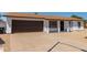 Charming single-story home with a brown garage door at 17052 N 36Th Ct, Phoenix, AZ 85032