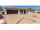 Charming single-story home with a brown garage door at 17052 N 36Th Ct, Phoenix, AZ 85032