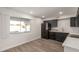 Modern kitchen featuring dark cabinetry and stainless steel appliances at 17052 N 36Th Ct, Phoenix, AZ 85032