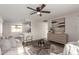 Open living room with a view into the kitchen at 17052 N 36Th Ct, Phoenix, AZ 85032