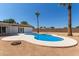 Blue kidney shaped pool in sunny backyard setting at 17052 N 36Th Ct, Phoenix, AZ 85032