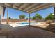 Inviting kidney-shaped pool with patio cover and spacious backyard at 17052 N 36Th Ct, Phoenix, AZ 85032