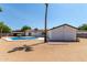 Home exterior with pool and spacious backyard at 17052 N 36Th Ct, Phoenix, AZ 85032