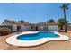 Home exterior showcasing a kidney-shaped pool at 17052 N 36Th Ct, Phoenix, AZ 85032