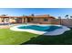 Inviting backyard with a sparkling pool and artificial turf at 1741 N Lehmberg Ave, Casa Grande, AZ 85122