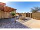 Brick paved patio with fire pit and covered seating area at 1741 N Lehmberg Ave, Casa Grande, AZ 85122