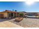 Large backyard with fire pit, patio, and partial pool view at 1741 N Lehmberg Ave, Casa Grande, AZ 85122