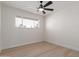 Bright bedroom with window and ceiling fan at 1741 N Lehmberg Ave, Casa Grande, AZ 85122