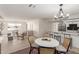 Charming dining area with a round table and four chairs near kitchen at 1741 N Lehmberg Ave, Casa Grande, AZ 85122