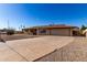 Single story home with a two-car garage and spacious driveway at 1741 N Lehmberg Ave, Casa Grande, AZ 85122