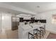 Modern kitchen with white cabinets, marble countertops, and stainless steel appliances at 1741 N Lehmberg Ave, Casa Grande, AZ 85122