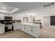 Modern kitchen with white cabinets and a large island at 1741 N Lehmberg Ave, Casa Grande, AZ 85122