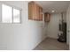 Laundry room with wood cabinets and vinyl flooring at 1741 N Lehmberg Ave, Casa Grande, AZ 85122