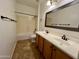 Bathroom boasts double sinks, a tub, and tiled floors at 17597 W Aster Dr, Surprise, AZ 85388