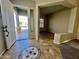 Entryway with tile flooring and a decorative medallion at 17597 W Aster Dr, Surprise, AZ 85388