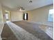 Living area with carpet and tile flooring at 17597 W Aster Dr, Surprise, AZ 85388