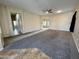 Large living room with carpet and tile flooring at 17597 W Aster Dr, Surprise, AZ 85388