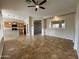 Spacious living room with tile flooring and kitchen view at 17597 W Aster Dr, Surprise, AZ 85388