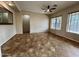 Living area with tile flooring and a ceiling fan at 17597 W Aster Dr, Surprise, AZ 85388