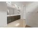 Bathroom featuring double sinks, shower and a large mirror at 17638 W Rancho Dr, Litchfield Park, AZ 85340