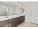Bathroom featuring double sinks and a large mirror at 17638 W Rancho Dr, Litchfield Park, AZ 85340