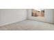 Bright bedroom featuring neutral carpeting, a window and fresh, neutral paint at 17638 W Rancho Dr, Litchfield Park, AZ 85340