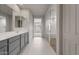Primary bathroom featuring a double vanity and glass enclosed shower at 17644 W Rancho Dr, Litchfield Park, AZ 85340