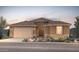 One-story home with tile roof, two-car garage, and desert landscaping at 17644 W Rancho Dr, Litchfield Park, AZ 85340