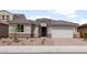Charming single-story home with a tile roof, desert landscaping, and a two-car garage at 17644 W Rancho Dr, Litchfield Park, AZ 85340