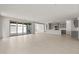 Expansive living room blending into the kitchen, featuring large sliding doors to the outdoor area at 17644 W Rancho Dr, Litchfield Park, AZ 85340