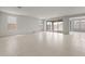 Bright and airy living room with tile flooring and large sliding glass doors to the backyard at 17644 W Rancho Dr, Litchfield Park, AZ 85340